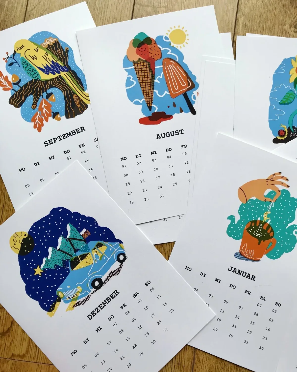 Illustrated wall calendar with native animals, month pages on display